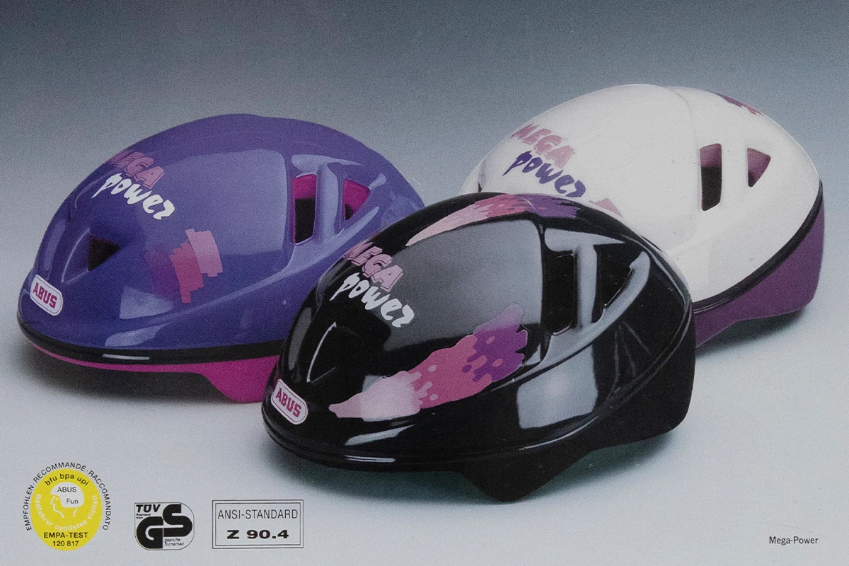 Blue, pink and black versions of the ABUS Mega-Power bike helmet for teenagers © ABUS
